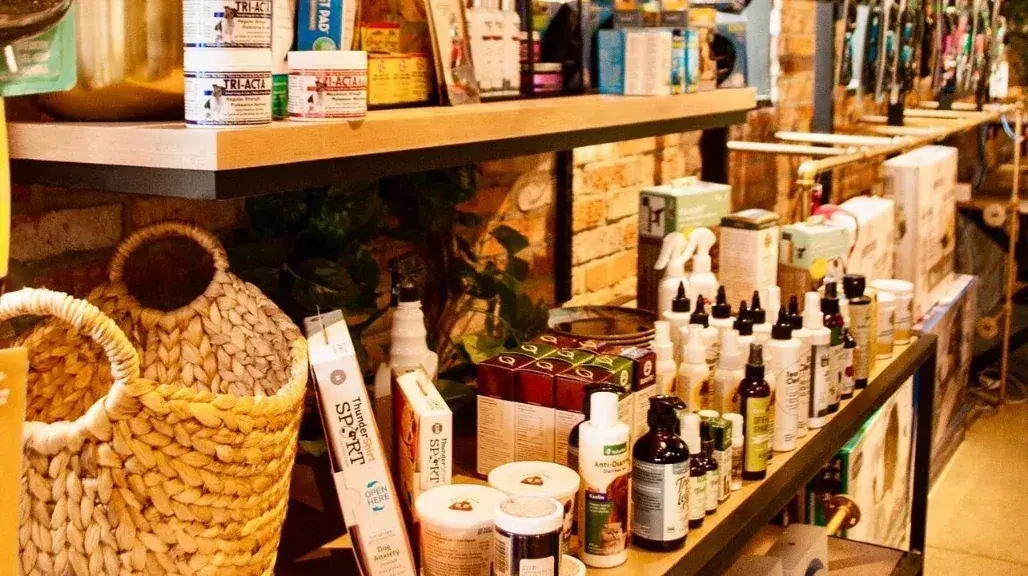 Dog supplements, shampoos and care products on a shelf at Lola’s Corner